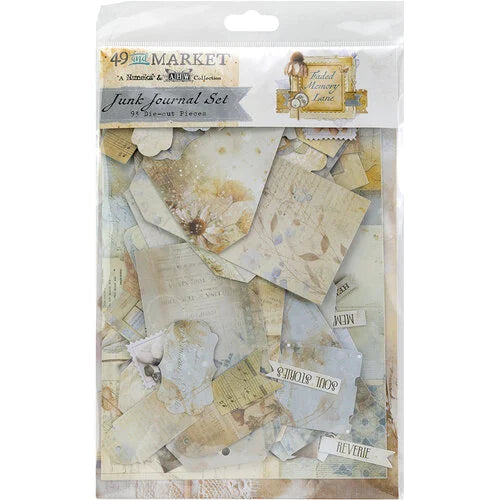 Packaged junk journal set with decorative papers and ephemera on a white background