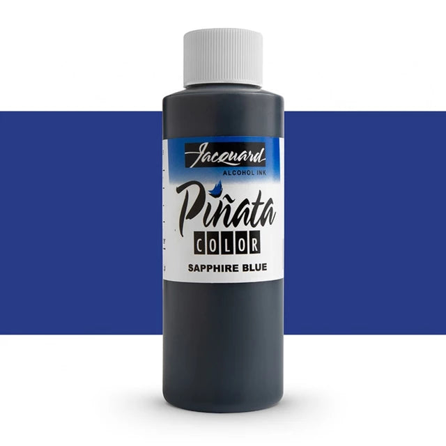A bottle of Jacquard Alcohool Ink Piñata Color in Sapphire Blue, shown against a white background with a wide blue horizontal band behind the bottle.
