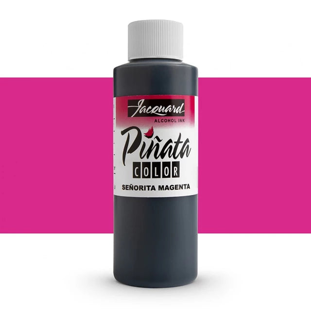 A bottle of Jacquard Alcoholic Ink in the shade 'Señorita Magenta', featuring a dark magenta-colored bottle with a white cap and a white label with pink and black text, set against a white background with a horizontal magenta band.