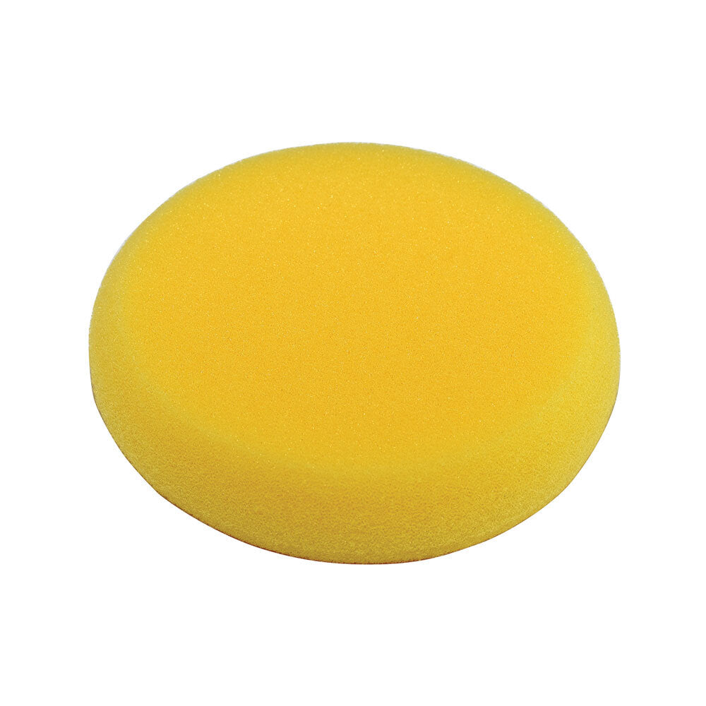 A round yellow foam applicator pad or sponge disc, shown from a top-down view on a plain white background.