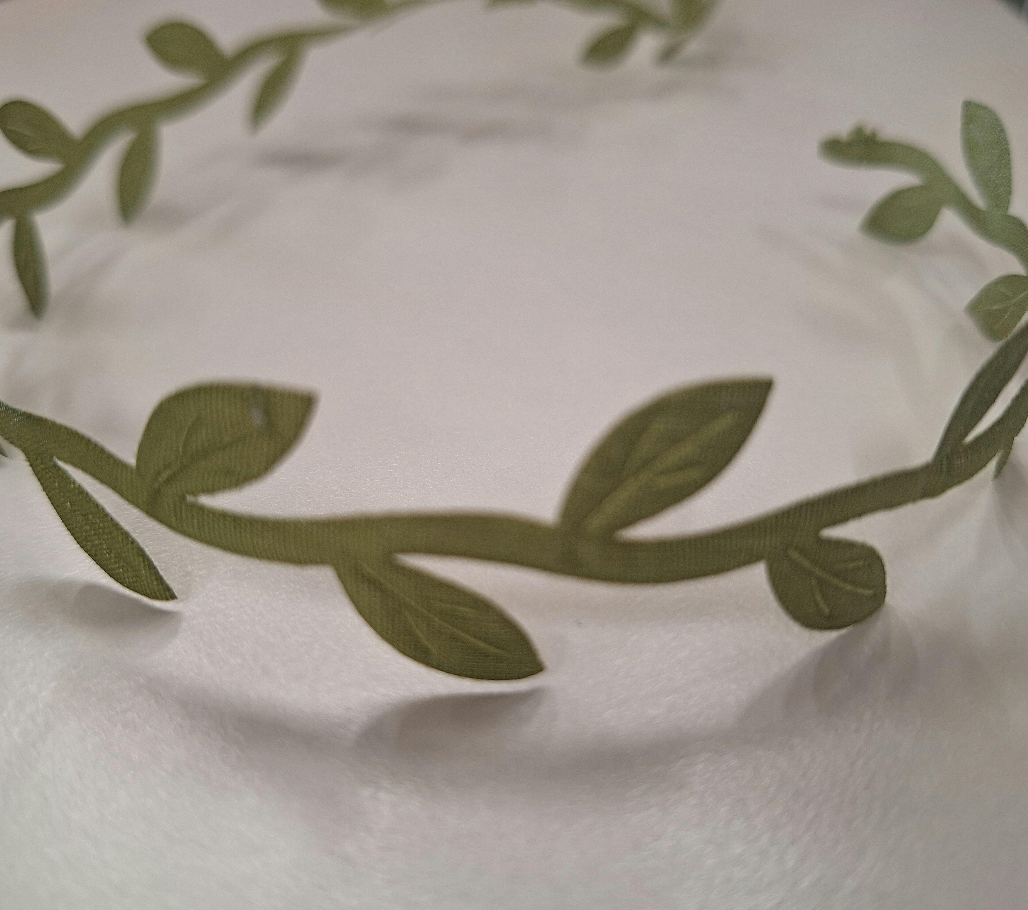 Green leaf pattern ribbon, 15mm wide. Sold by the metre.