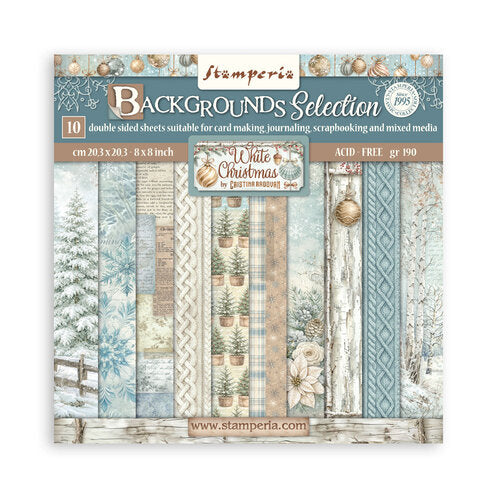 Stamperia Christmas-themed paper pack with winter scenery and text on a white background