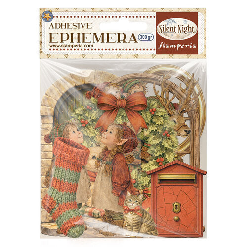 A 300g pack of Stamparia 'Silent Night' adhesive ephemera featuring a vintage illustration of children in a snowy scene with a large red bow, holly, a red mailbox, and a cat, sealed in clear plastic packaging with a branded header card.