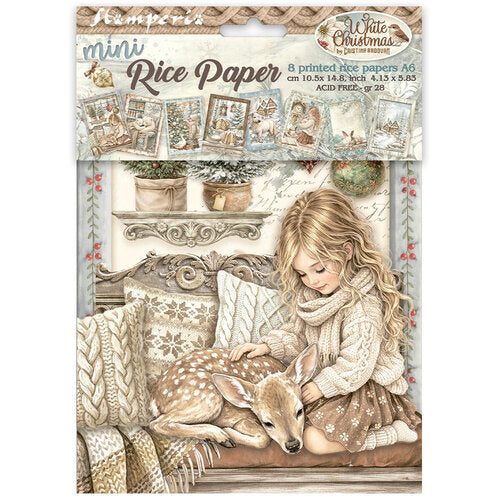 A packaged sheet of mini Christmas-themed rice paper from the brand Hamperis. The sheet features an illustration of a young blonde girl in a cozy sweater and scarf petting a white-tailed deer, with a warm rustic shelf, potted plants, and other holiday decorations in the background.