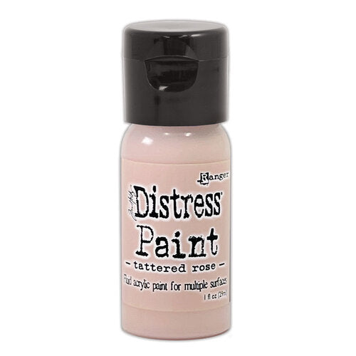 Bottle of Ranger Distress Paint in tattered rose color on a white background