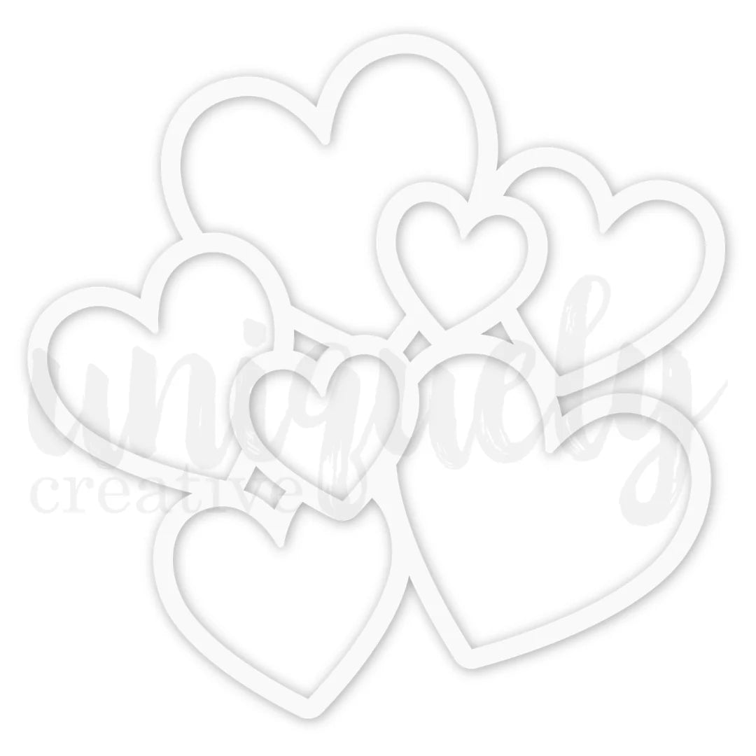 White heart-shaped cut outs on a white background
