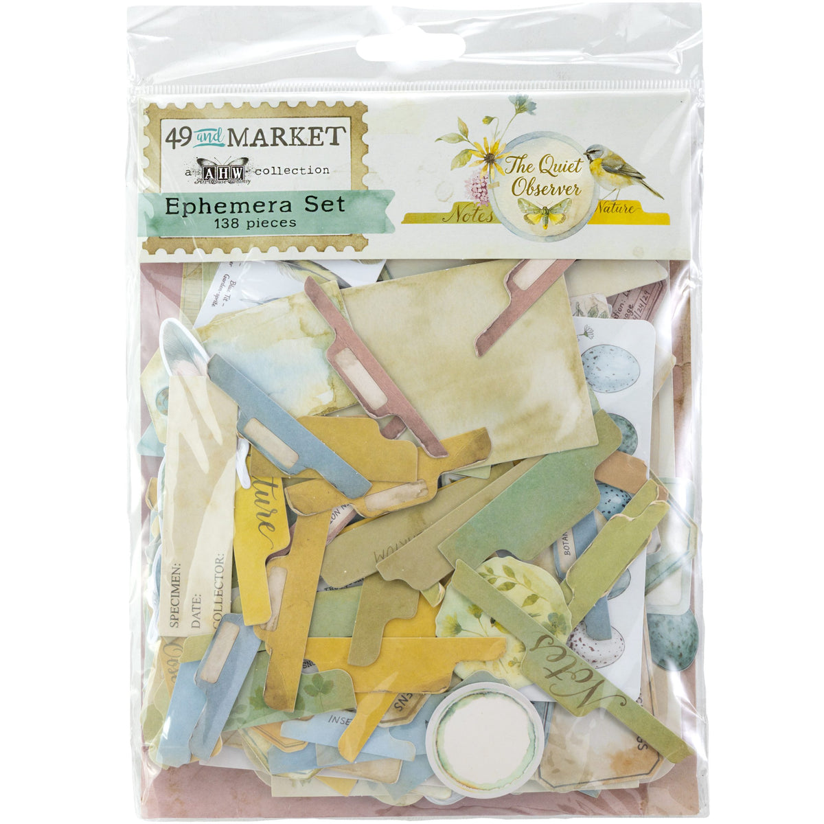 A packaged craft ephemera set from 49 and Market, featuring 138 assorted paper scraps in muted pastel colors including yellow, green, blue, and beige, sealed in a clear plastic bag with a printed header card.