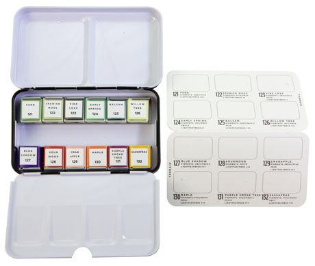 Set of flavored tobacco pouches in a clear plastic case with labels on a white background.
