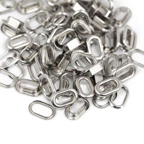 Pile of metal eyelets on a white background