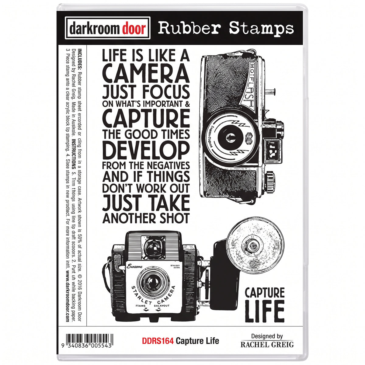 Darkroom Door Capture Life cling rubber stamp set in its clear storage case, featuring camera designs and photography-themed sentiments