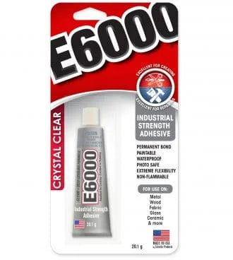 E6000 Crystal Clear industrial strength adhesive in a 13.1 g tube, packaged on a red and white card with the E6000 logo.