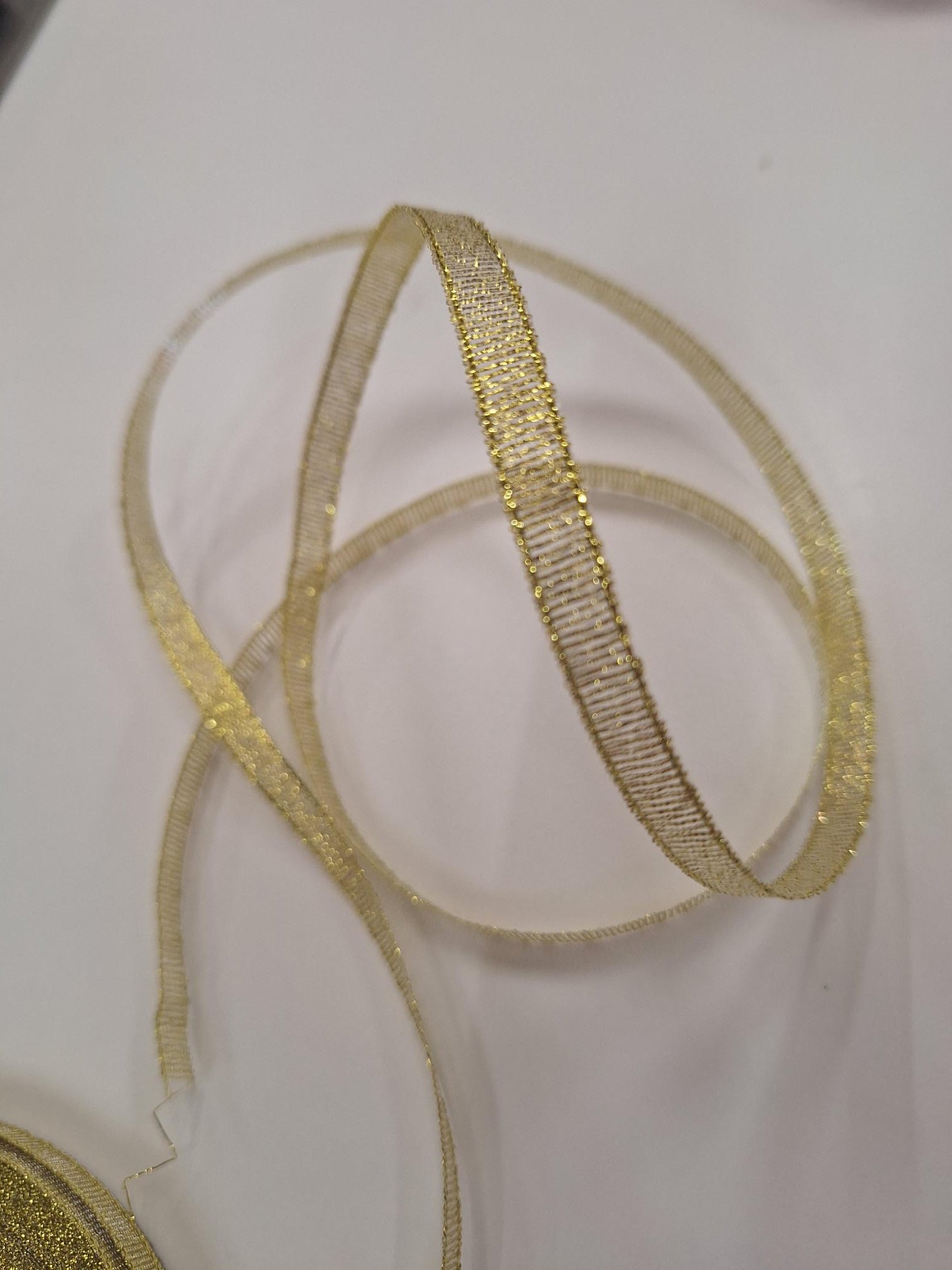 Gold metallic ribbon 6mm wide. Sold by the metre