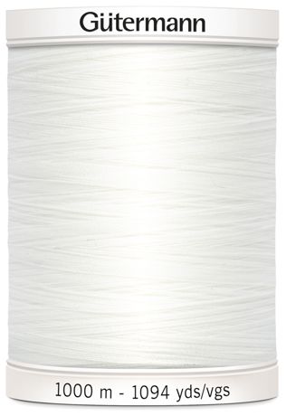 Spool of Gutermann thread with white background