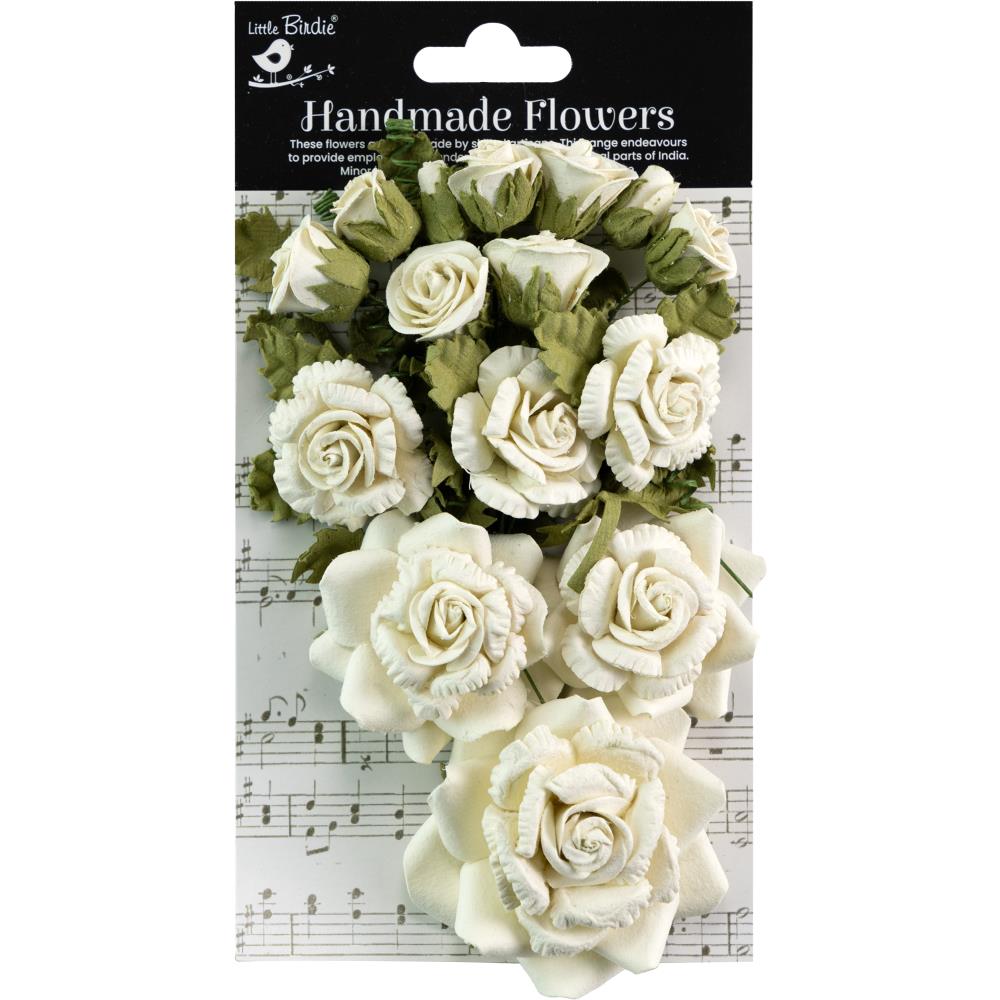 Packaged handmade flowers with white and green colors on a music sheet background