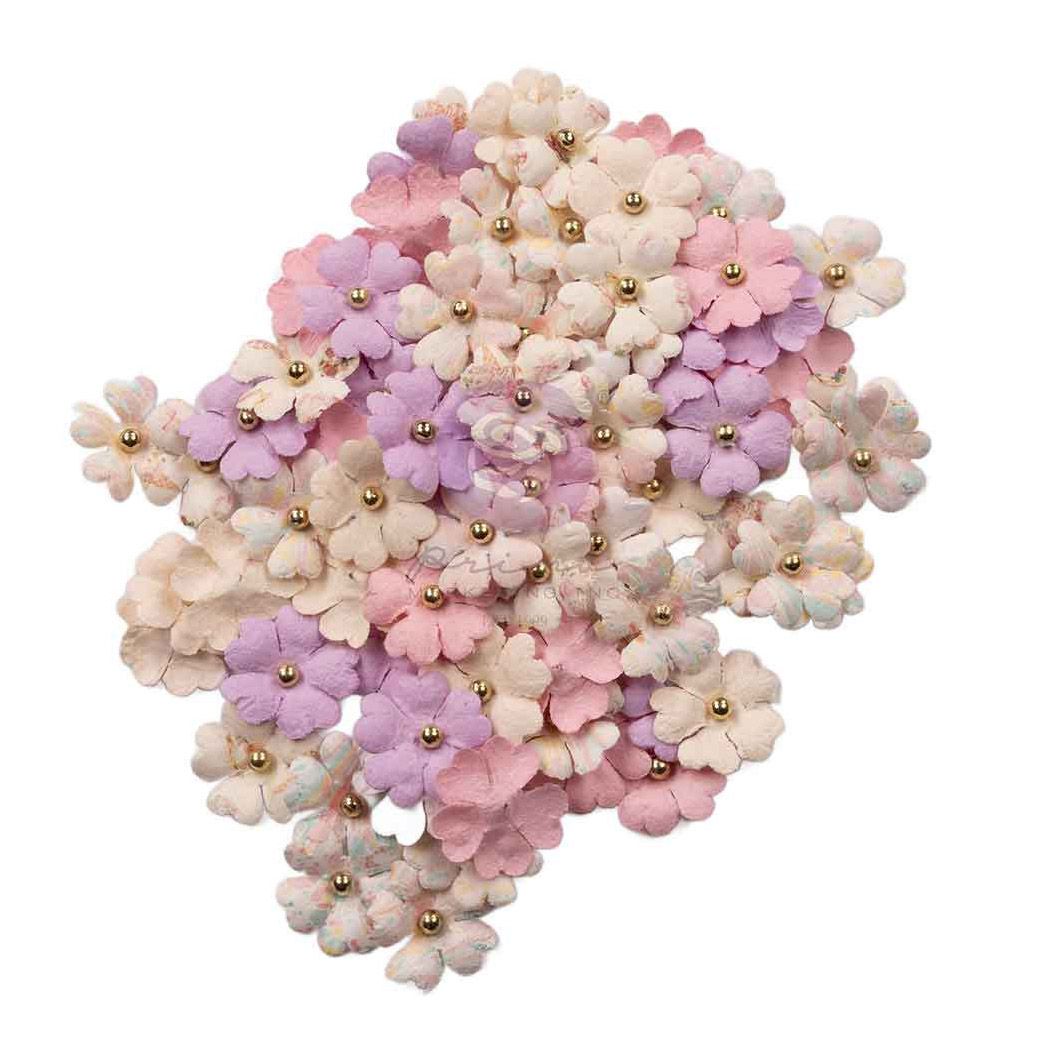 Pastel-colored flower-shaped product with gold accents on a white background