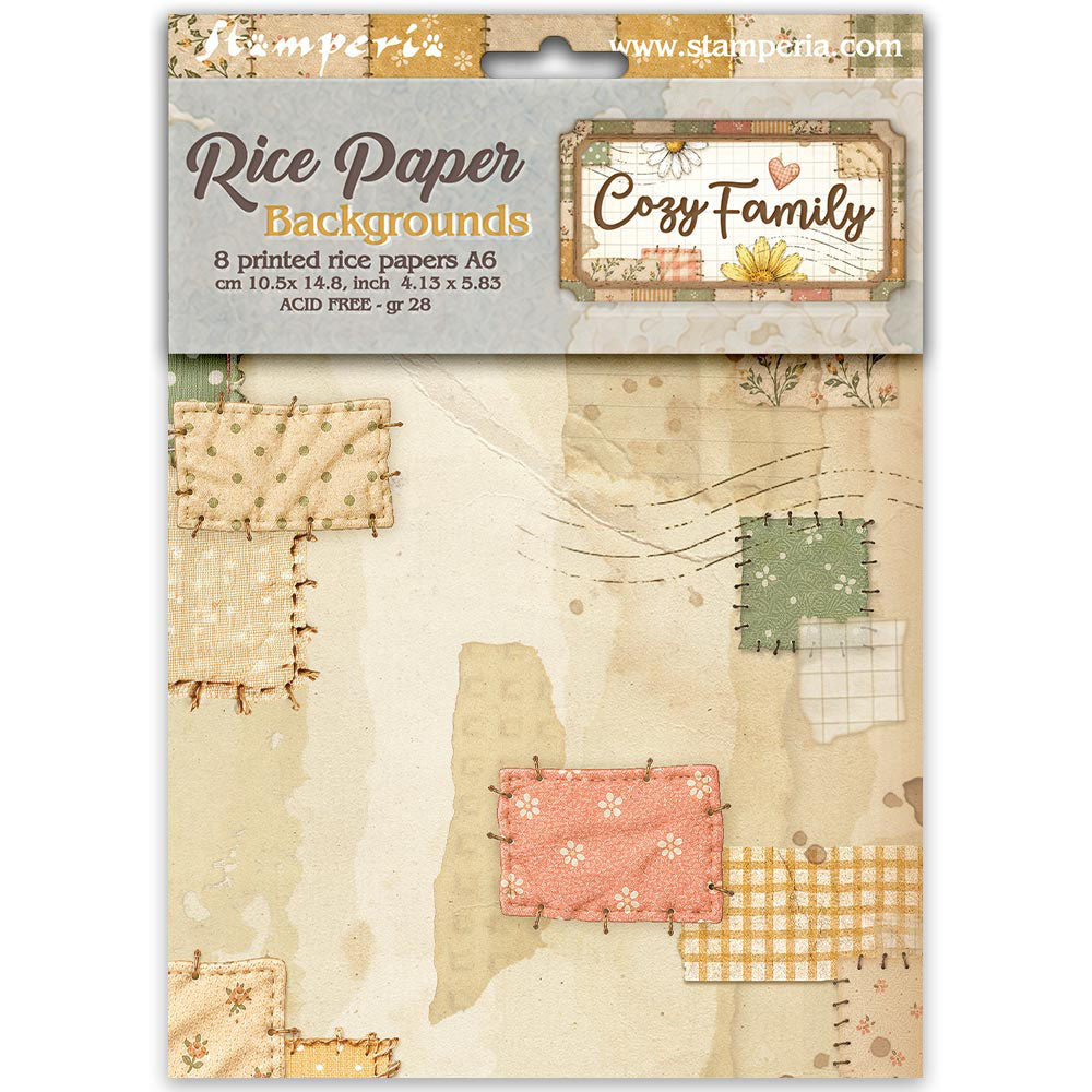 Stamperia Rice Paper Backgrounds 'Cozy Family' pack containing 8 printed rice papers in an A6 size sheet, featuring a patchwork design with beige, pink, green, and yellow patterns on a light gray background.