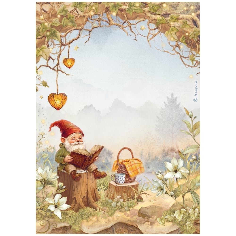 Gnome reading a book in a garden setting with flowers and a basket.