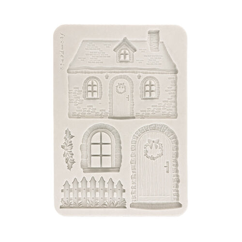 A rectangular silicone mold with embossed house and door designs, shown on a plain white background.