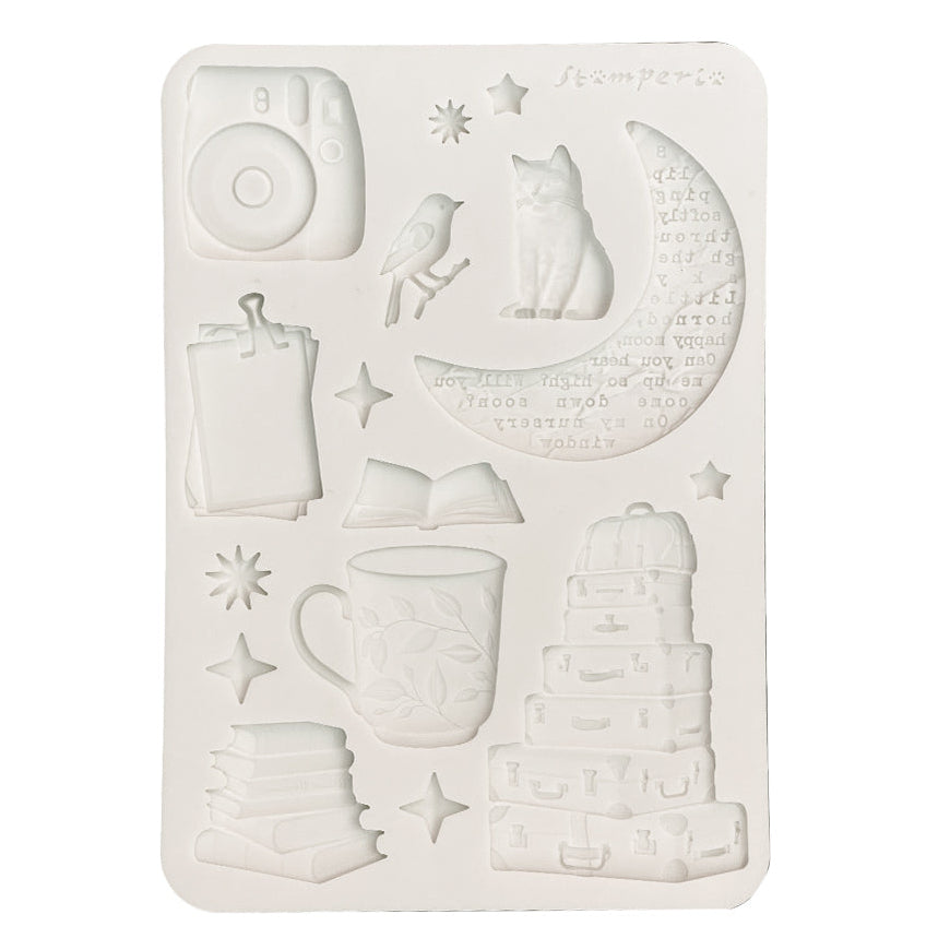 White silicone mould with various designs on a white background