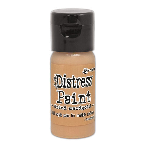 Bottle of Ranger Distress Paint in Dried Marigold color on a white background