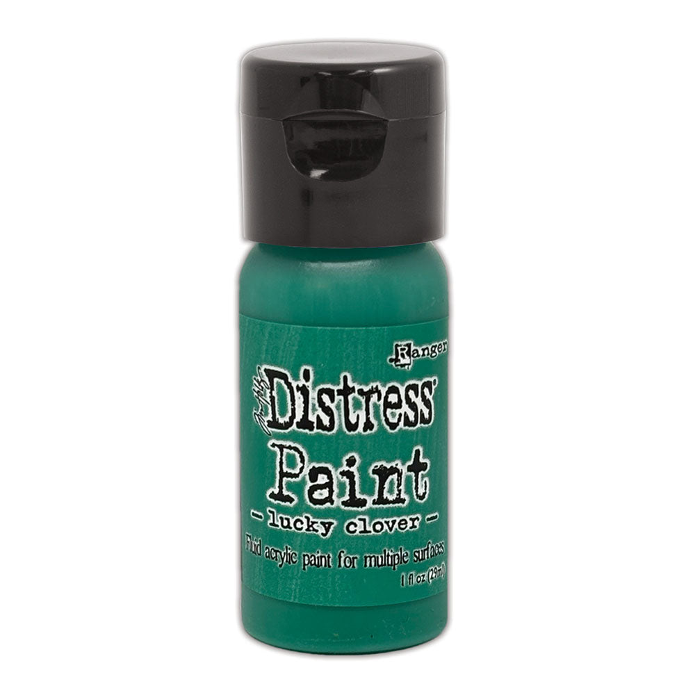 Green bottle of Ranger Distress Paint with black cap on a white background