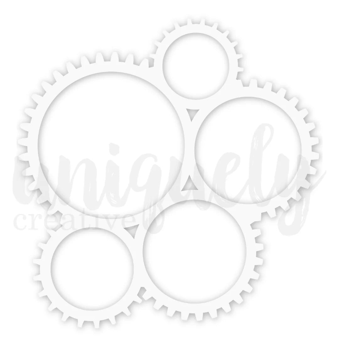 A white metal gear die-cut stencil with five interlocking circular gears of varying sizes, shown on a white background with a faint watermark.