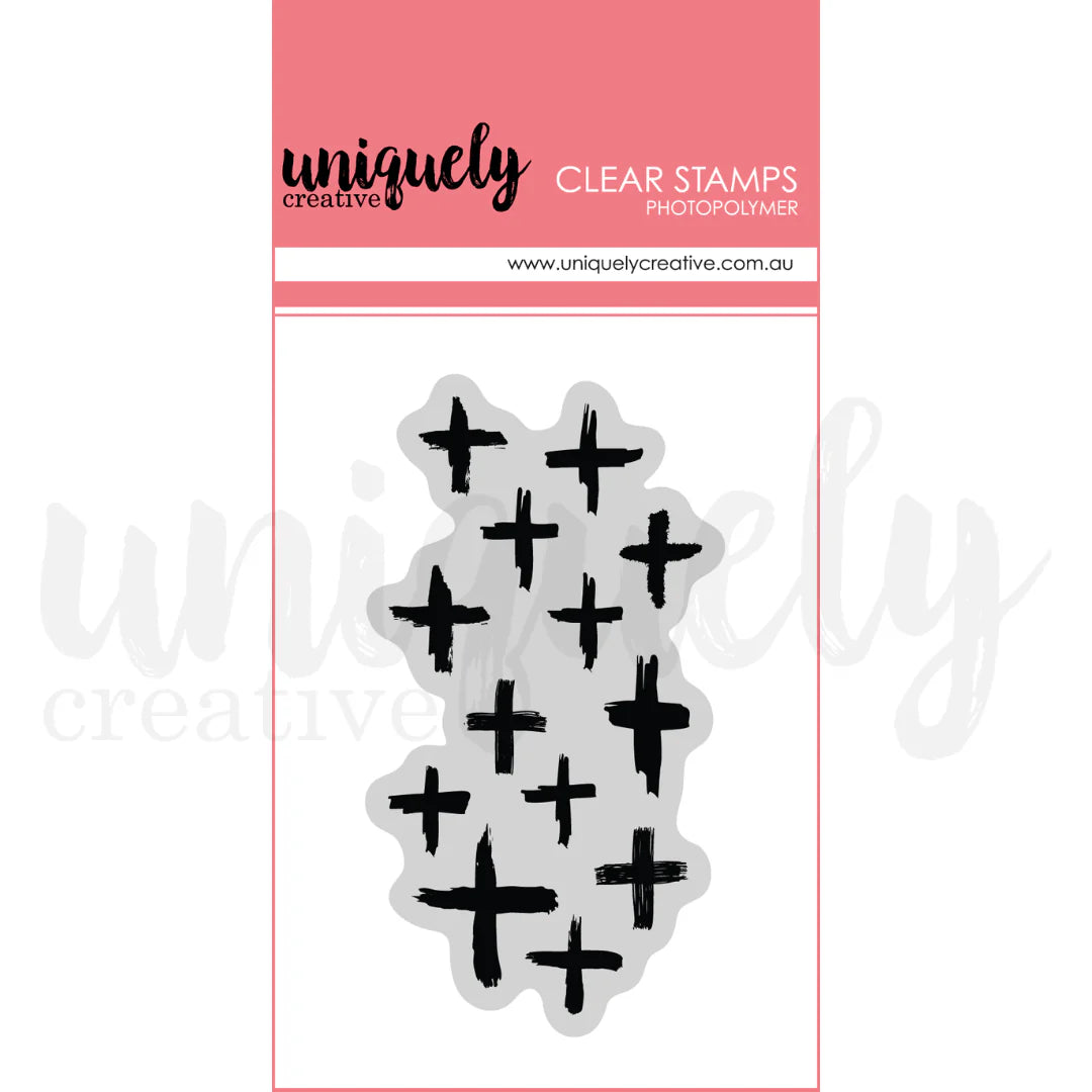 Clear stamps with black plus signs on a Uniquely Creative packaging.