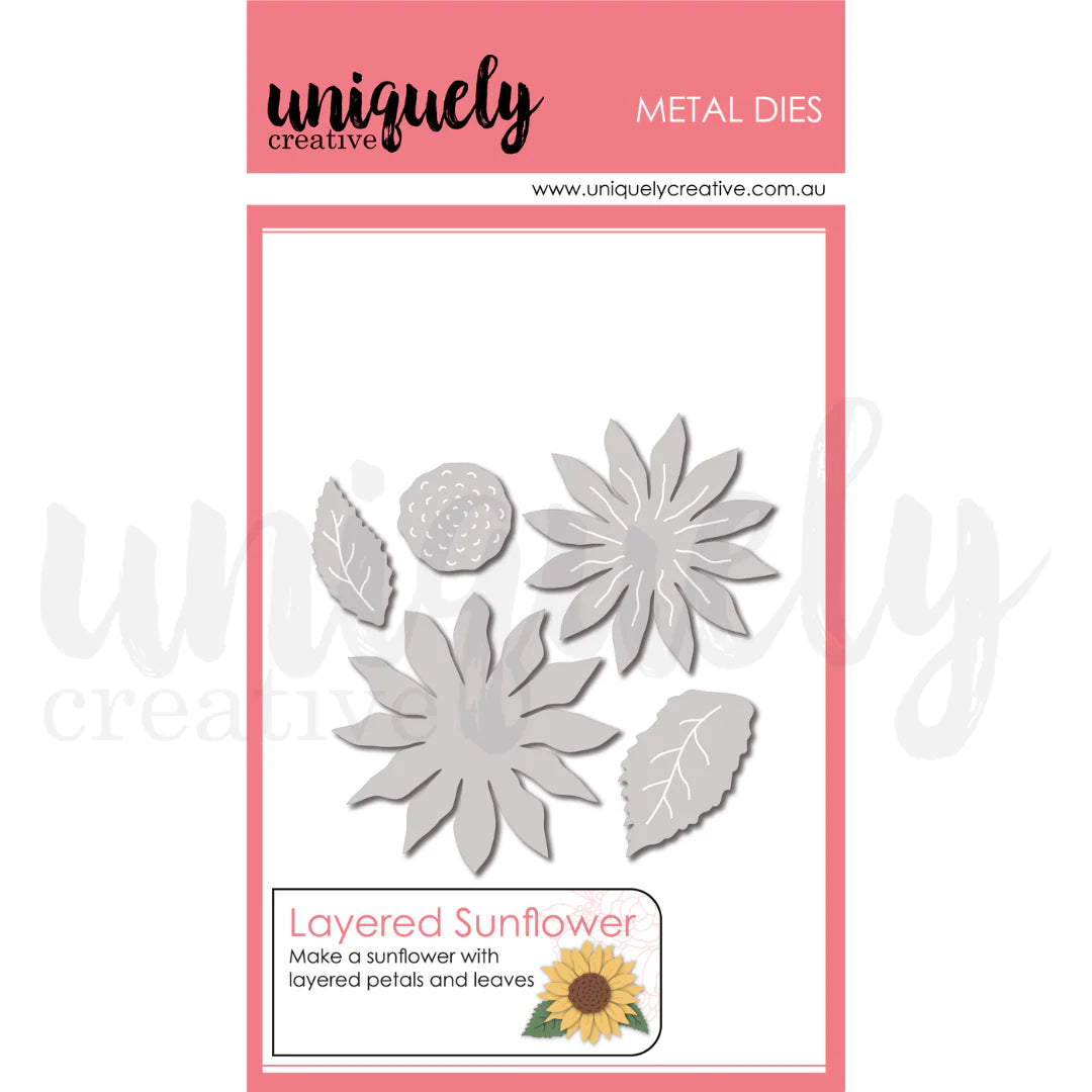 Metal dies with sunflower and leaf shapes on a pink and white background
