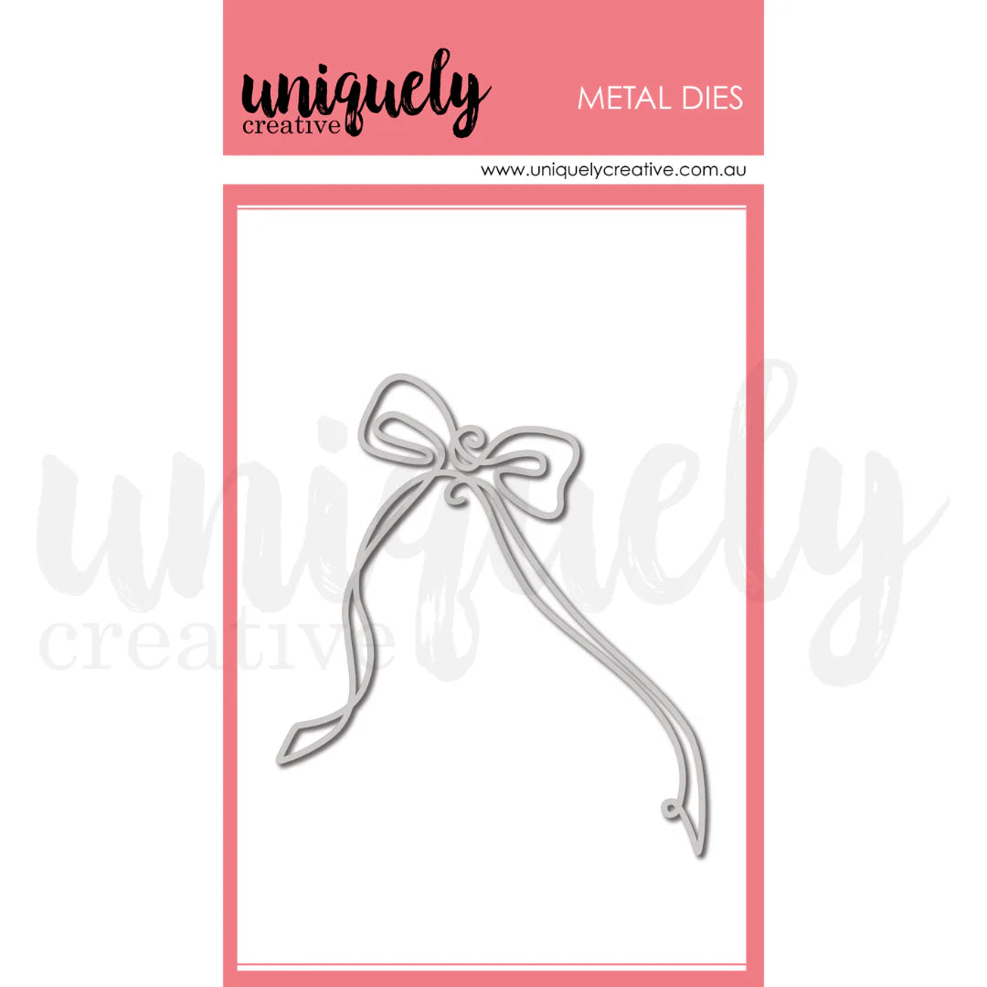 Metal die shaped like a bow on a pink and white background with 'uniquely creative' branding.