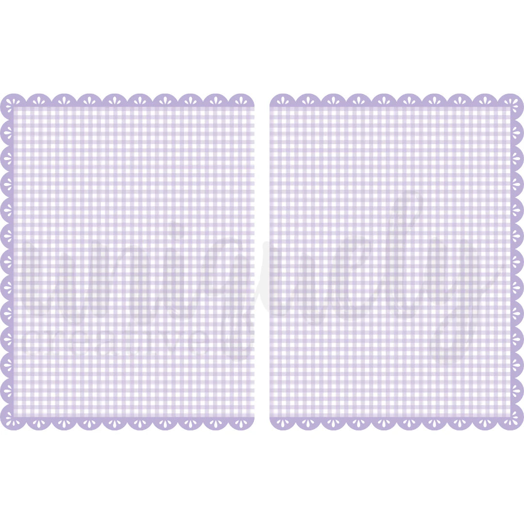 Two purple checkered placemats with scalloped edges on a white background