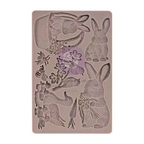 Silicone mold with rabbit and floral designs on a beige background
