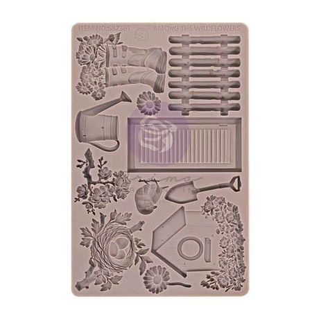 Decorative silicone mold with gardening-themed elements on a beige background
